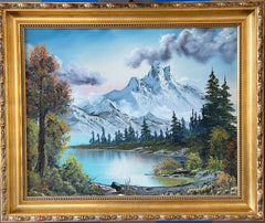 A framed Bob Ross painting depicting a landscape with mountains, trees, and a sky, signed by the artist.