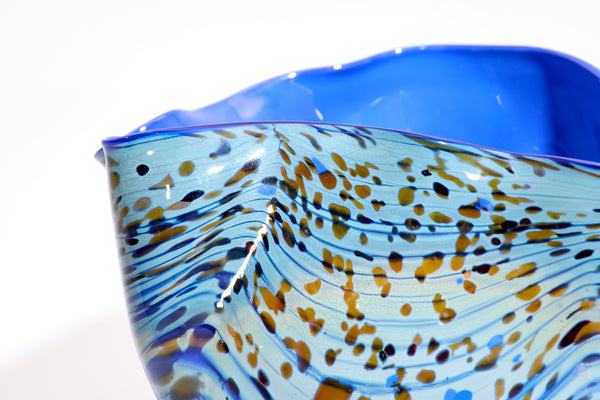 Dale Chihuly / Blue Opal Macchia (1982), a signed and dated hand-blown glass sculpture measuring 4.75 inches high by 5.5 inches in diameter