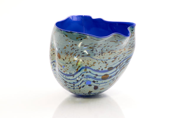 Dale Chihuly / Blue Opal Macchia (1982), a signed and dated hand-blown glass sculpture measuring 4.75 inches high by 5.5 inches in diameter