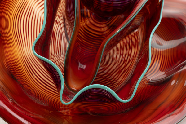 Dale Chihuly, Four Piece Red Seaform Set with Turquoise Lip Wrap, (1987) is a hand-blown glass sculpture featuring four organic red forms accented with a vibrant turquoise lip wrap