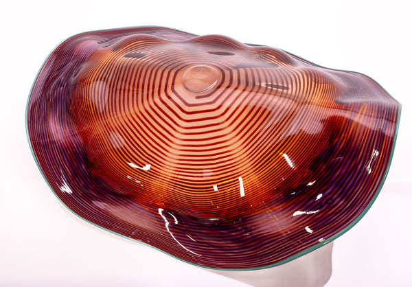 Dale Chihuly, Four Piece Red Seaform Set with Turquoise Lip Wrap, (1987) is a hand-blown glass sculpture featuring four organic red forms accented with a vibrant turquoise lip wrap