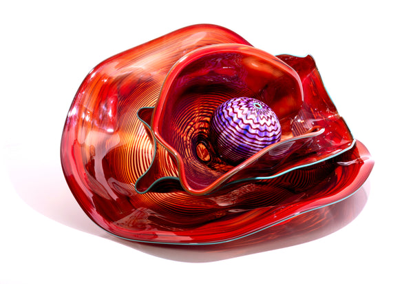 Dale Chihuly, Four Piece Red Seaform Set with Turquoise Lip Wrap, (1987) is a hand-blown glass sculpture featuring four organic red forms accented with a vibrant turquoise lip wrap