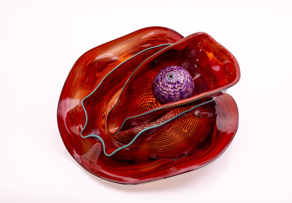 Dale Chihuly, Four Piece Red Seaform Set with Turquoise Lip Wrap, (1987) is a hand-blown glass sculpture featuring four organic red forms accented with a vibrant turquoise lip wrap