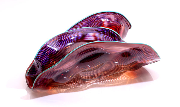 Dale Chihuly, Four Piece Red Seaform Set with Turquoise Lip Wrap, (1987) is a hand-blown glass sculpture featuring four organic red forms accented with a vibrant turquoise lip wrap