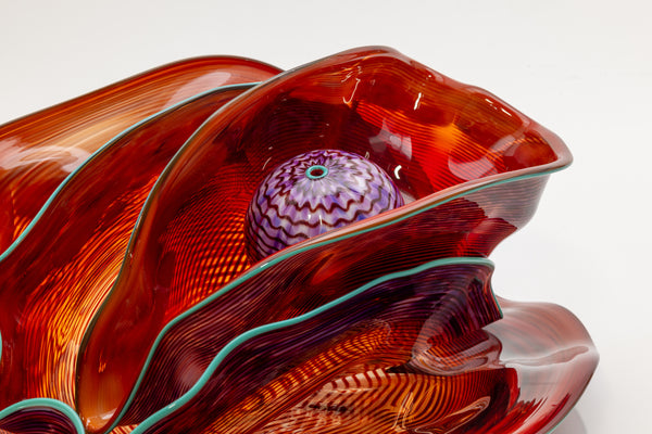 Dale Chihuly, Four Piece Red Seaform Set with Turquoise Lip Wrap, (1987) is a hand-blown glass sculpture featuring four organic red forms accented with a vibrant turquoise lip wrap