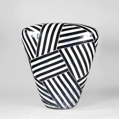 Jun Kaneko's, "Dango", is a 2003 monumental (40x38x15 inch) fired-clay ceramic sculpture from his celebrated Dango series, known for its rounded "dumpling" form and bold surface patterning.