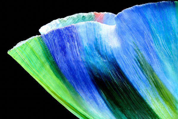 Mary Ann "Toots" Zynsky's *Untitled (Multicolor)* (c. 2000-2010) is a sculptural glass vessel featuring an undulating rim and vibrant bands of color that create depth and movement. Measuring 9.75" x 19" x 10", the work is signed "Z" on the underside.