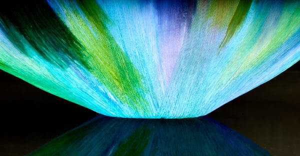 Mary Ann "Toots" Zynsky's *Untitled (Multicolor)* (c. 2000-2010) is a sculptural glass vessel featuring an undulating rim and vibrant bands of color that create depth and movement. Measuring 9.75" x 19" x 10", the work is signed "Z" on the underside.