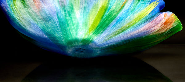 Mary Ann "Toots" Zynsky's *Untitled (Multicolor)* (c. 2000-2010) is a sculptural glass vessel featuring an undulating rim and vibrant bands of color that create depth and movement. Measuring 9.75" x 19" x 10", the work is signed "Z" on the underside.