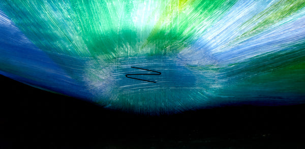 Mary Ann "Toots" Zynsky's *Untitled (Multicolor)* (c. 2000-2010) is a sculptural glass vessel featuring an undulating rim and vibrant bands of color that create depth and movement. Measuring 9.75" x 19" x 10", the work is signed "Z" on the underside.