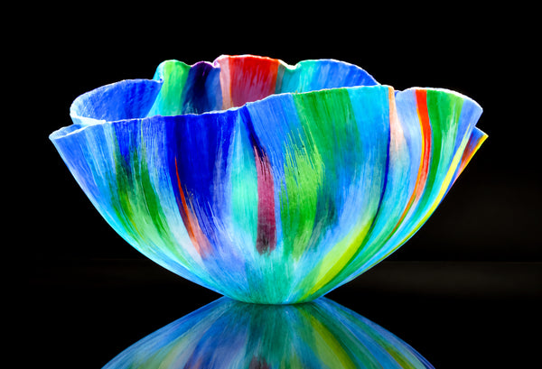 Mary Ann "Toots" Zynsky's *Untitled (Multicolor)* (c. 2000-2010) is a sculptural glass vessel featuring an undulating rim and vibrant bands of color that create depth and movement. Measuring 9.75" x 19" x 10", the work is signed "Z" on the underside.