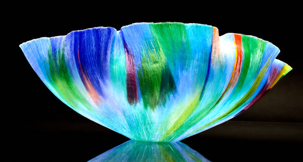 Mary Ann "Toots" Zynsky's *Untitled (Multicolor)* (c. 2000-2010) is a sculptural glass vessel featuring an undulating rim and vibrant bands of color that create depth and movement. Measuring 9.75" x 19" x 10", the work is signed "Z" on the underside.