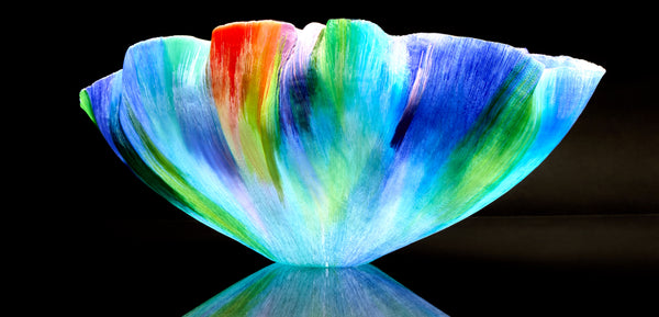 Mary Ann "Toots" Zynsky's *Untitled (Multicolor)* (c. 2000-2010) is a sculptural glass vessel featuring an undulating rim and vibrant bands of color that create depth and movement. Measuring 9.75" x 19" x 10", the work is signed "Z" on the underside.