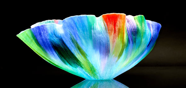 Mary Ann "Toots" Zynsky's *Untitled (Multicolor)* (c. 2000-2010) is a sculptural glass vessel featuring an undulating rim and vibrant bands of color that create depth and movement. Measuring 9.75" x 19" x 10", the work is signed "Z" on the underside.