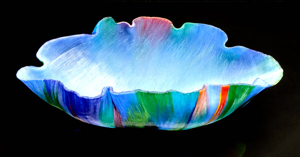 Mary Ann "Toots" Zynsky's *Untitled (Multicolor)* (c. 2000-2010) is a sculptural glass vessel featuring an undulating rim and vibrant bands of color that create depth and movement. Measuring 9.75" x 19" x 10", the work is signed "Z" on the underside.