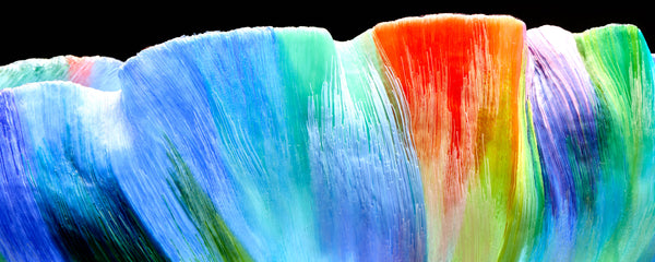 Mary Ann "Toots" Zynsky's *Untitled (Multicolor)* (c. 2000-2010) is a sculptural glass vessel featuring an undulating rim and vibrant bands of color that create depth and movement. Measuring 9.75" x 19" x 10", the work is signed "Z" on the underside.